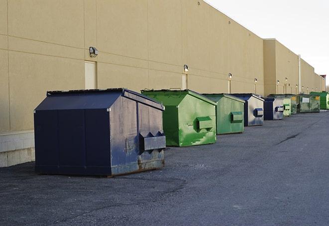 dumpsters with safety cones in a construction area in Dayton, NV